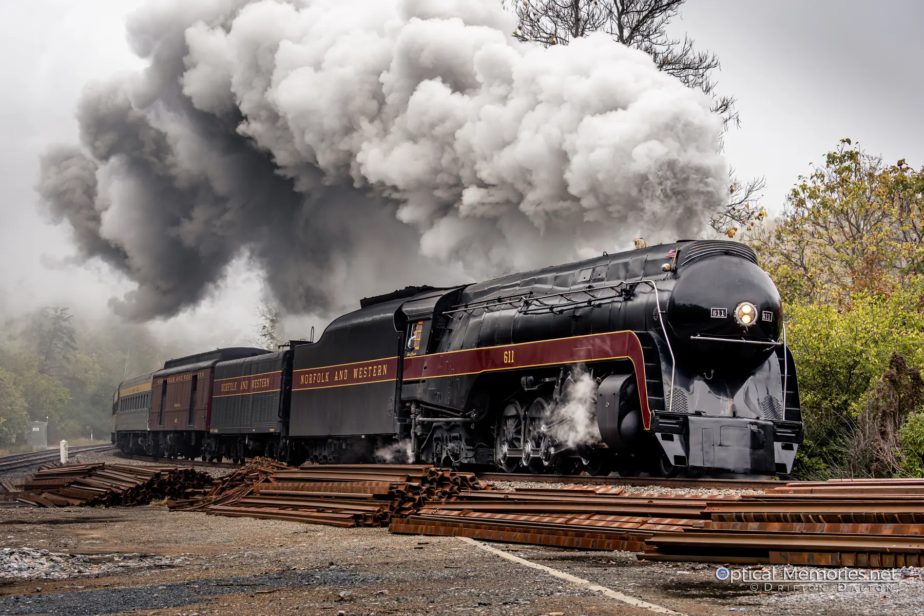 Norfolk and Western steam locomotive 611 emerging head-on through mist and smoke
