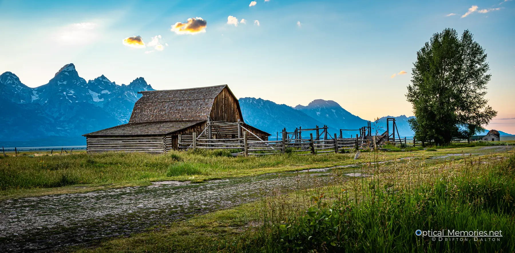 Historic Mormon Row barn and weathered fencing beneath the Teton Range